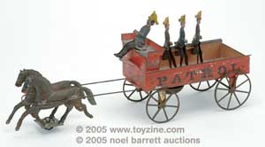 This early American tin fire toy dates from the last quarter of the 19th century. The delicacy and almost primitive quality renders and almost folk-art appearance