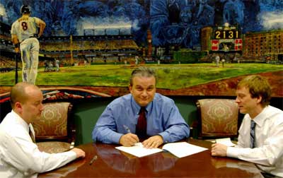 Dan Morphy (left) and Tom Sage Jr. (right), co-founders of Morphy Auctions, have sold their business to entrepreneur Steve Geppi (center).